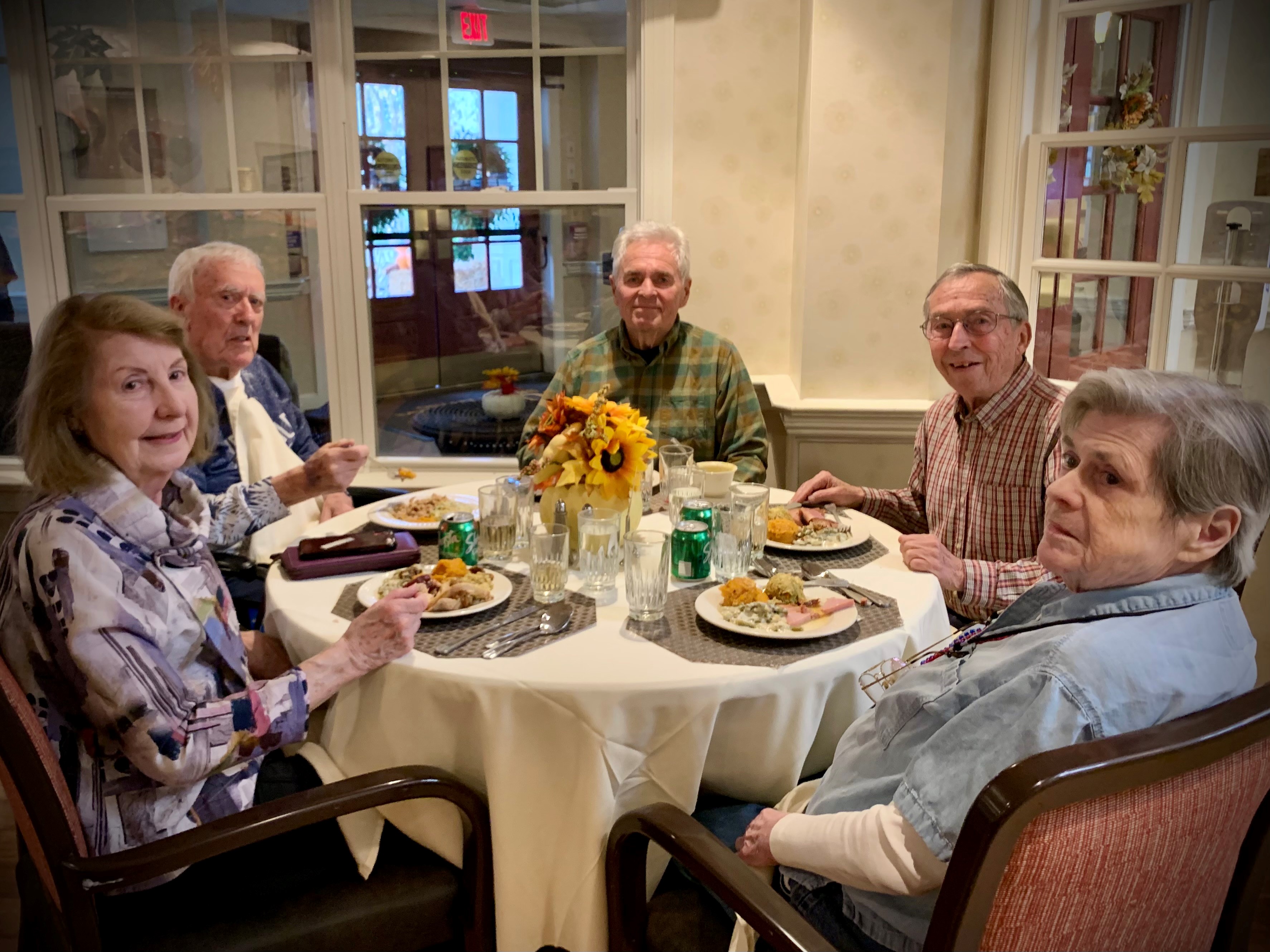 Residents enjoying a meal together
